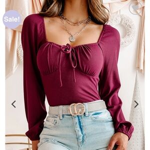 Raspberry long sleeve front tie bodysuit